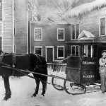 Delivering bread by horse-drawn sleigh, circa 1915.