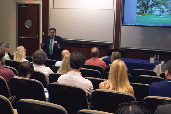 Dean highlights growth, new building in homecoming talk