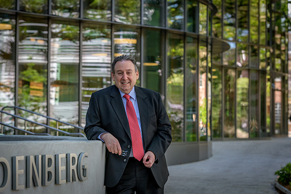 Ira Solomon in front of the Goldring/Woldenberg Business Complex