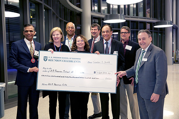 Dean Solomon receives a gift from the 2019 Reunion class.