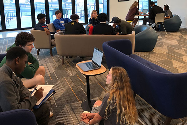 Finance students help high schoolers become investors